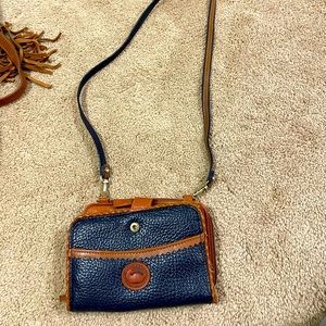 Dooney and Bourke crossbody purse. Navy and tan leather